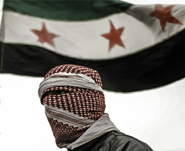 Syria Independence Flag behind a Free Syrian Army member