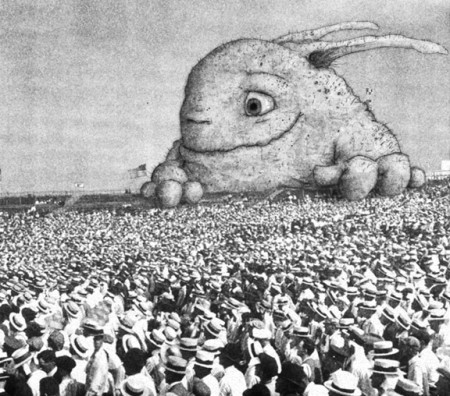 A cute Monster overlooking a crowd of people